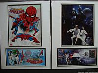 Photo showing both framed first day covers side by side including The Amazing Spider-Man and Star Wars artwork and related stamps, suitable for framing and display.