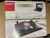 Box photo showing the ION Profile Pro USB Turntable with Input branding and image of the turntable connected to a laptop computer.