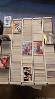 Photo of a box full of trading cards with football and basketball cards on top