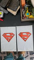 Two sealed plastic bags with Superman logo, containing Superman #500 comics