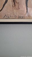Lower left corner showing signature “Picasso XXXI” on paper edge