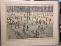 Full front view of the framed art print showing the winter ice skating scene and the white mat inside the metal frame.