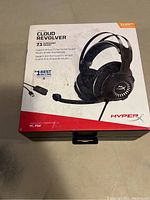 Front image of the HyperX Cloud Revolver headset retail box showcasing the product, compatibility with PC and PS4, and 7.1 surround sound feature.