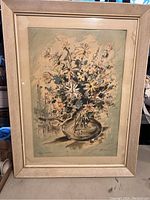 Full front view of framed watercolour painting with bouquet of flowers and cityscape background by John Haymson.