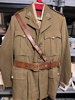 Full front view of tunic with Sam Browne belt and cross strap