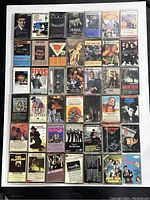 Top-down image showing the full layout of 42 cassette tapes arranged in seven rows and six columns, displaying front covers.