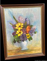Frontal photo of the vintage oil painting showing the full floral arrangement in vase and the frame.