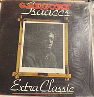 Front cover of Gregory Isaacs "Extra Classic" vinyl record, showing framed sepia portrait and title text.