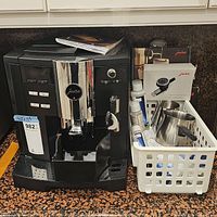 Front view of Jura espresso machine with control panel and drip tray