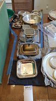 Overall view of polished silver-plated lot on table