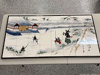 Full view of the 32-piece tile mural mounted on plywood showing a Japanese palace under attack with multiple warriors depicted.