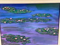 Close-up image showing the painting's water feature with lily pads and pink flowers floating on purple-blue water.