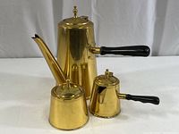 Full view of set: tall brass coffee pot, smaller creamer pot, and sugar container. Shows overall condition and appearance.
