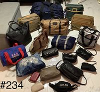 Photo showing the full assortment of various bags laid out on the floor including duffel bags, pouches, cooler bag, tote and small pockets