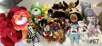 Group photo of miscellaneous stuffed animal plush dolls including Clifford, Care Bears, Lion King, and fabric dolls