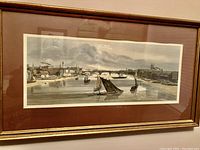 Frontal view of the framed picture showing the Thames River scene with boats and bridges under a cloudy sky, in muted tones.