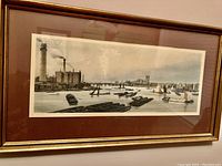 Framed panoramic print depicting London Bridge and the River Thames with historical style boats and buildings.