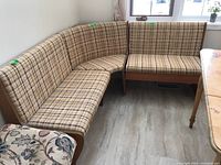 Three-piece bench seating set arranged near window on hardwood floor, showing overall seating and fabric pattern.