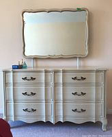 Full front view of six-drawer dresser with mirror mounted