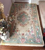 Area rug 3'3'' x 5'2'' floral design, showing central pattern and border.