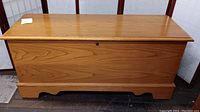 Side and front view of Lane cedar chest showing wood grain detail and craftsmanship.