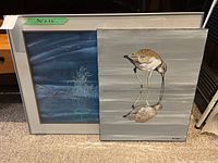 Two artwork pieces side by side showing framed picture and bird canvas painting.