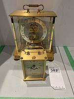 Front view of both clocks side by side
