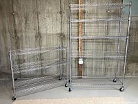 Two chrome wire shelving units against a concrete wall, one taller and one shorter, showing overall size and condition