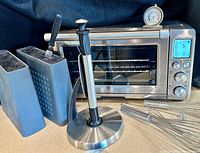 Front view showing oven, paper towel holder, Kapooosh holders, whisks, thermometer and sleeve