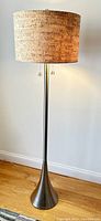 Full view of the completed floor lamp showing cork shade and brushed nickel base
