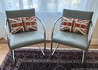 Front view of two chairs with lumbar pillows