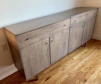 Front left angled view showing overall design, finish, and leg structure