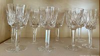 Eight Waterford wine goblets with diamond cut Lismore pattern, clear crystal, cut stems, starburst bases