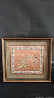 Full front view of framed Chinese embroidery painting on silk with floral and butterfly design.