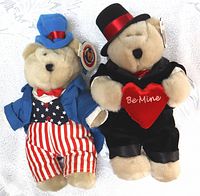 Front view of two Starbucks Teddy Bears from 2002, showing Independence Day and Valentine's Day themed costumes with original tags.