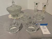 Full lot arranged with 2 Lenox vases, candy dish with lid, and 4 Durand dessert bowls