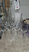 Photo of leaded crystal stemware set including multiple wine glasses with cut glass patterns
