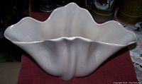Top and side views of white scalloped Beswick Ware vase showing size and smooth finish.