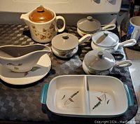 Photo showing full set: four lidded French onion soup dishes, gravy boat with plate, two-section tray, and ceramic teapot