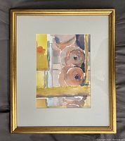 Front view of framed abstract watercolour painting with muted circular and geometric shapes in gold frame and white matting.