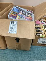 Box containing two Beanie Babies Collectors Club kits with visible plush bears and packaging.