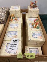Box containing 21 Cherished Teddies collectibles in original packaging, arranged neatly showing quantity and size (2.5 inches).
