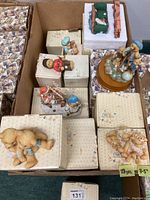 Box with approximately 28 Cherished Teddies figurines in original boxes, some figurines displayed on top of boxes for viewing.