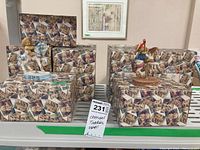 Photo showing two Cherished Teddies figurines on horse carousel stands, with decorative boxes behind them.