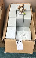 Box containing multiple Cherished Teddies Wes figurine boxes stacked inside
