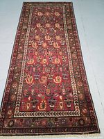 Full‐length view of the runner rug laid flat on grey floor