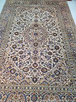 Full front view of rug showing central medallion and borders