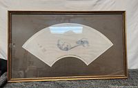 Photo of the framed Eastern rat painting, showing the full frame and the fan-shaped artwork within.