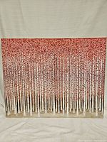 Front view of the 30x24 canvas painting showing a forest of numerous slender white-barked trees with red clustered leaves.