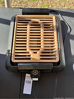 Top view of Goteway electric grill with non-stick grill plate and temperature control knob beneath the plate.